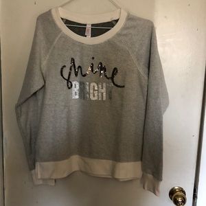 “Shine Bright” sweatshirt.